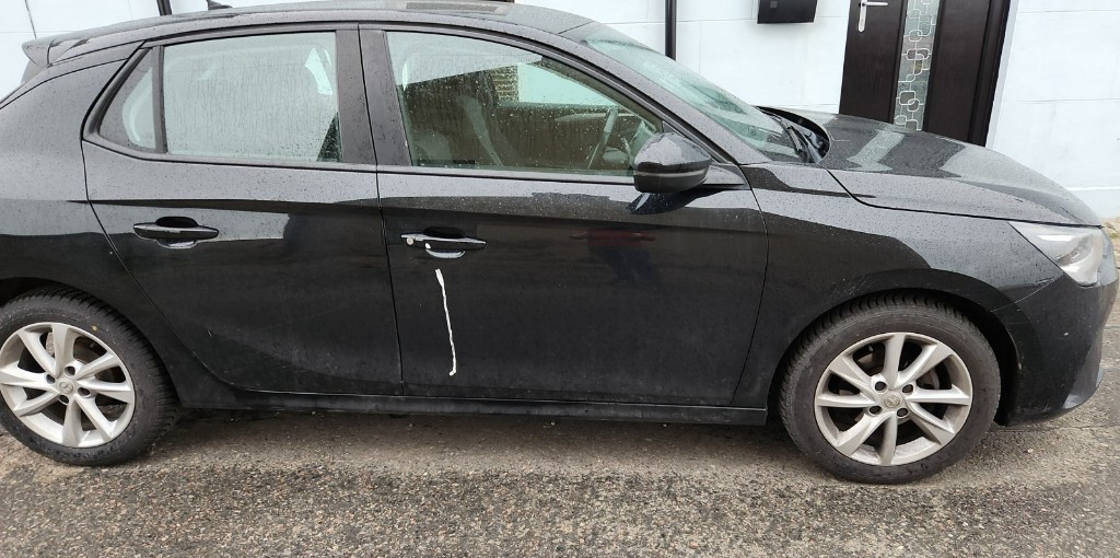 Dirty black Vauxhall Corsa with dust and marks before a valet