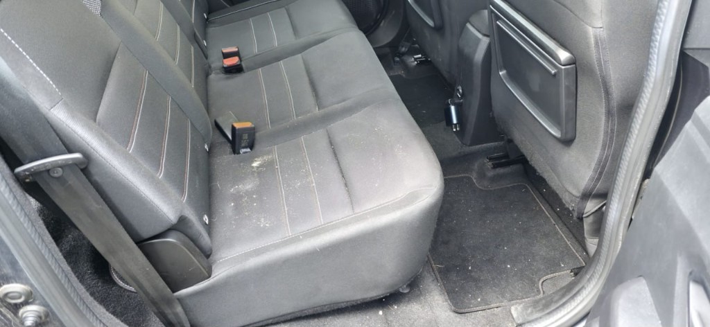 Dirty rear seats before an interior deep clean